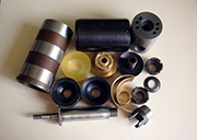 What are the material classifications of the pistons of mud pump parts?